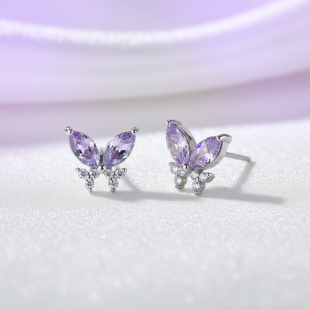 Twilight Lavender Butterfly Earrings with purple gemstones on a light background