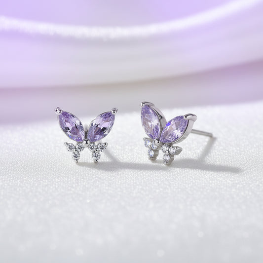Twilight Lavender Butterfly Earrings with purple gemstones on a light background