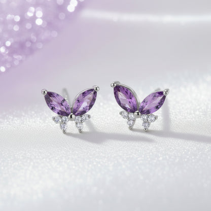Twilight Lavender Butterfly Earrings with purple gemstones on a soft gradient background