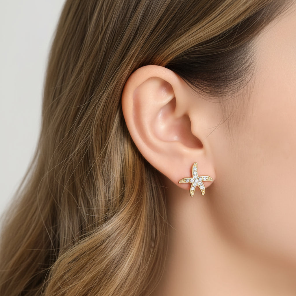 Pavé Starfish Earrings worn by a person with dark hair.