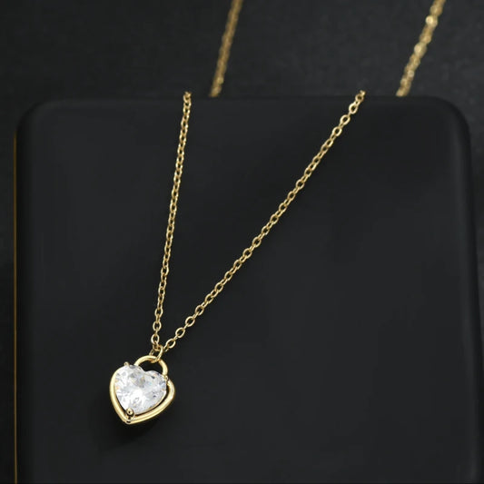 Zircon Heart Locket Necklace featuring a heart-shaped locket with sparkling zircons and an adjustable 16"-18" chain, on black jewelry box.