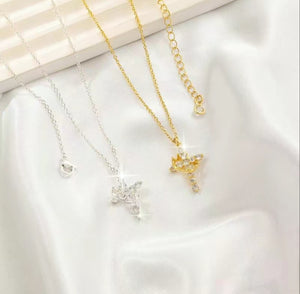 Silver Cross Crown Necklace with an adjustable 18"-20" chain and a cross pendant topped with a crown, shown next to the gold version.