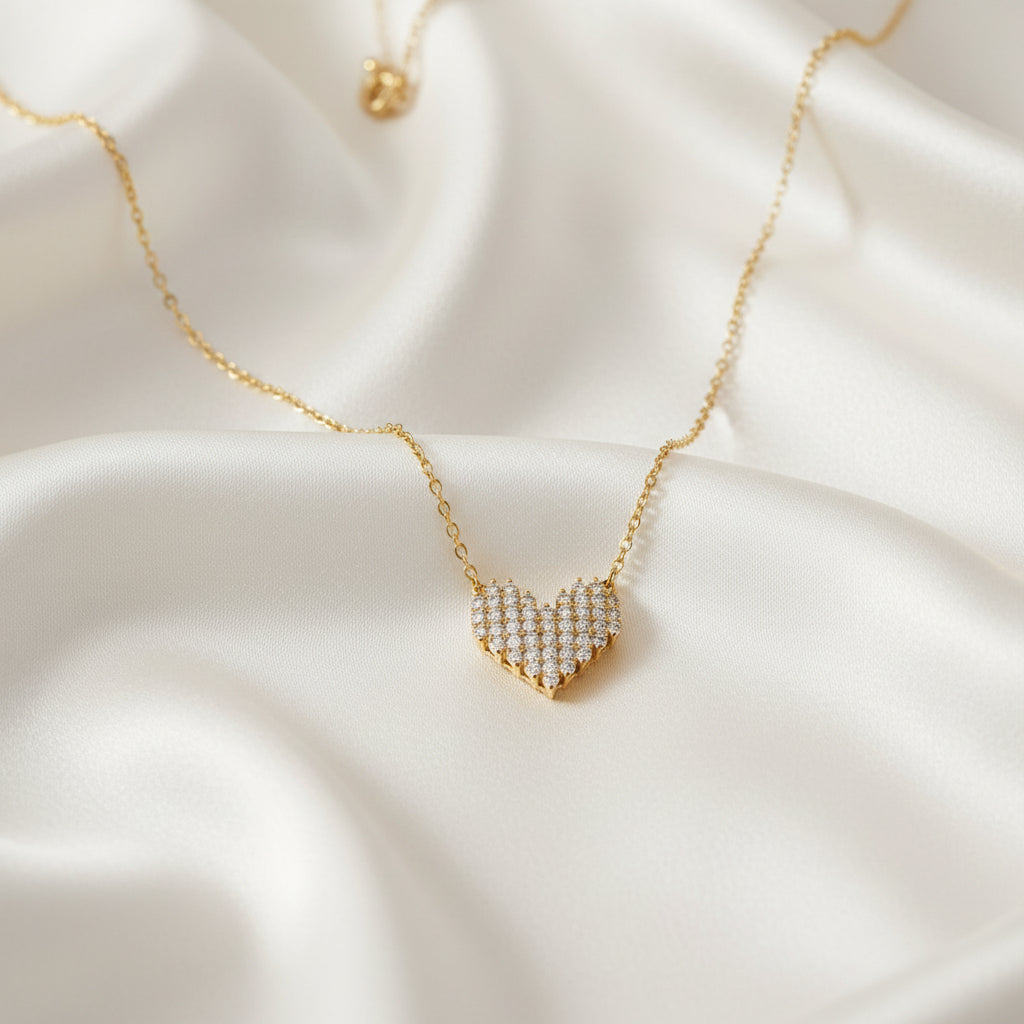 Rhinestone Heart Necklace with a heart-shaped pendant on a soft white fabric background