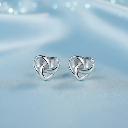 Infinity Knot Heart Earrings on a soft blue background