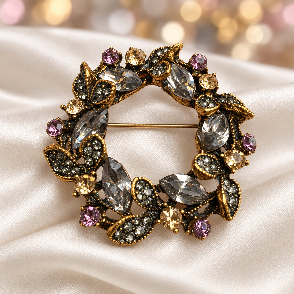 A close-up of a Jeweled Crystal Wreath Pin on white