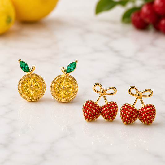 Lemon Slice & Gold Bow Strawberry Earring Set on a light background