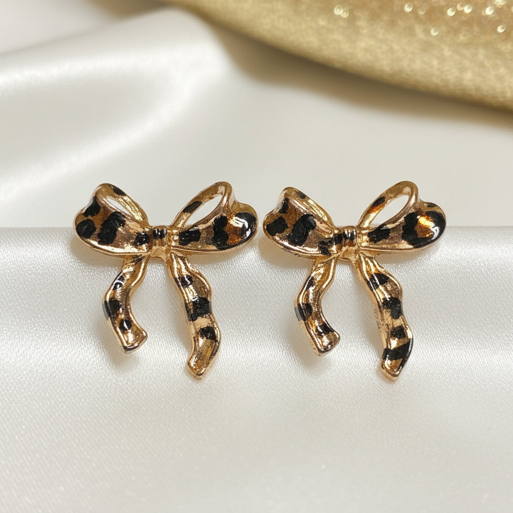 Leopard Print Bow Earrings on white background