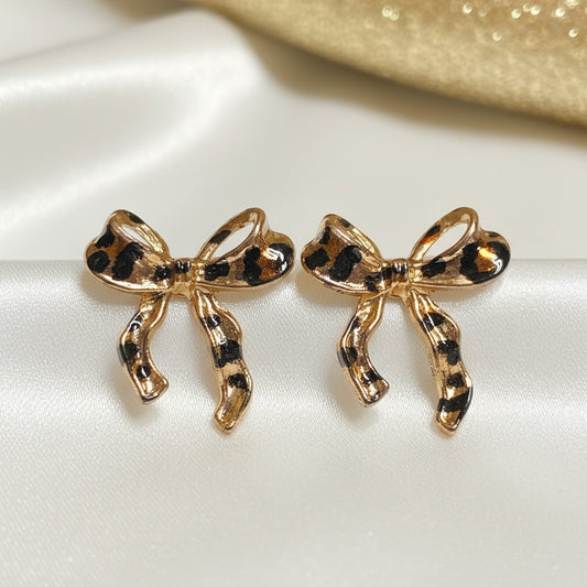 Leopard Print Bow Earrings on white background