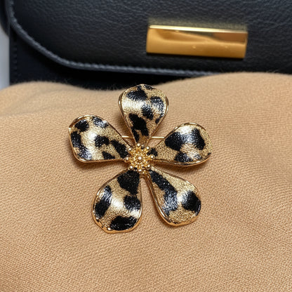 Leopard Print Flower Pin on tan sweater