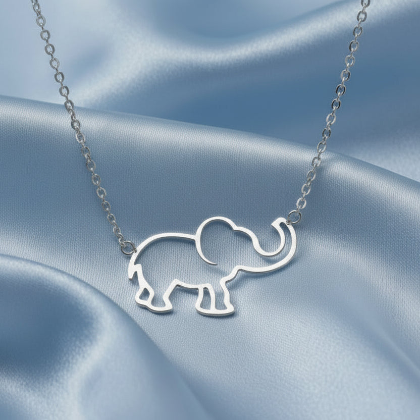 Silver Lucky Elephant Necklace on a blue satin background