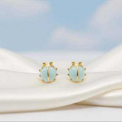 Mini Baby Blue Ladybug Earrings blue sky background