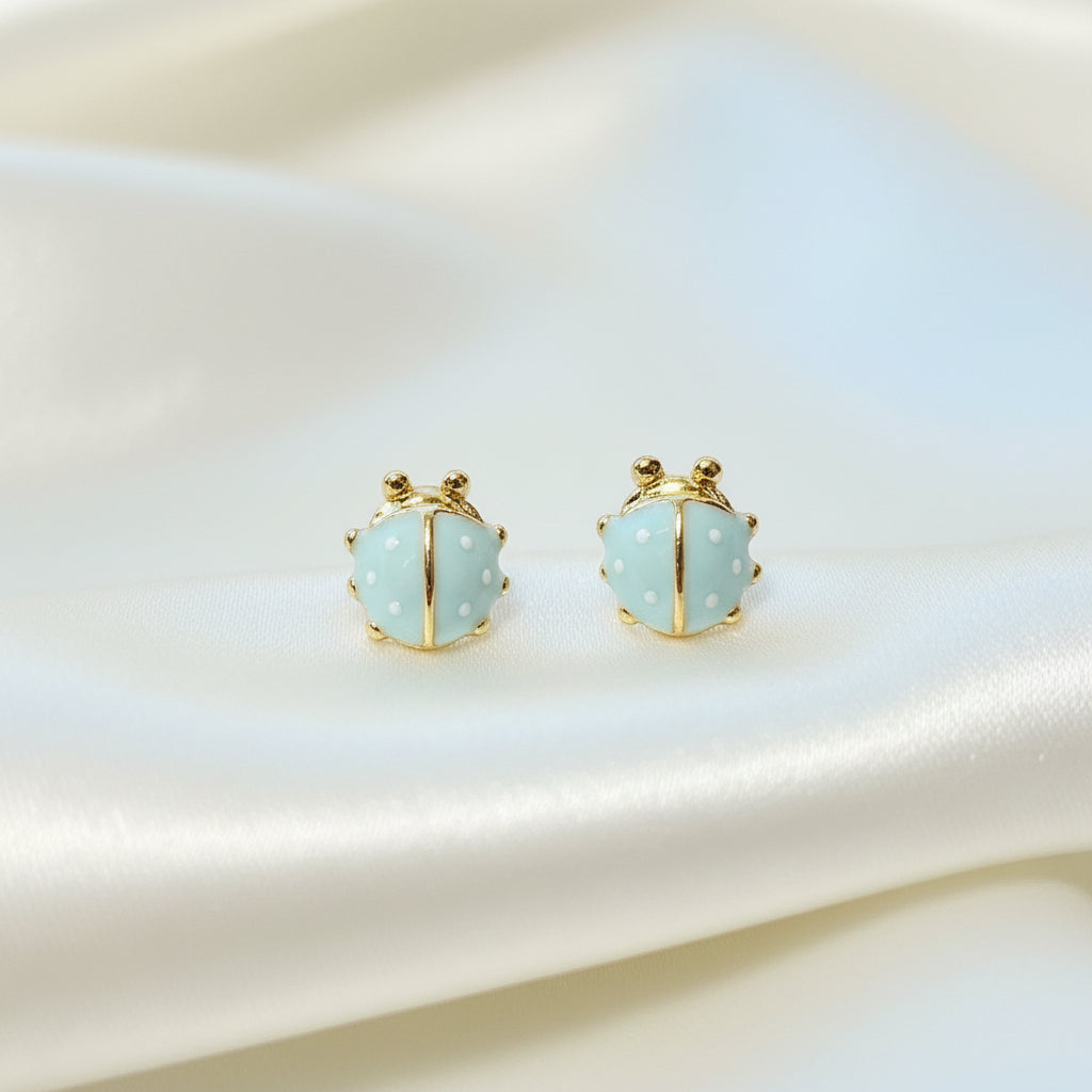 Mini Baby Blue Ladybug Earrings on white