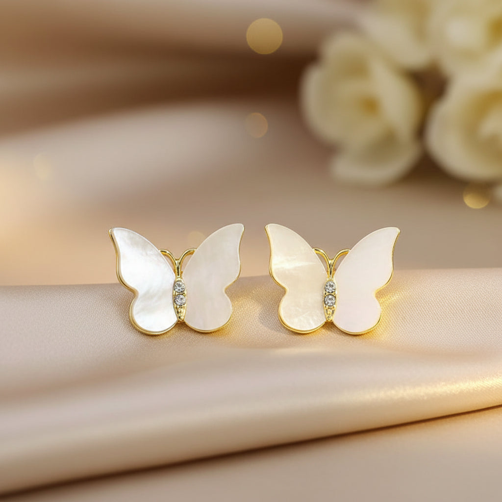 Mother of Pearl Butterfly Earrings on a soft fabric background