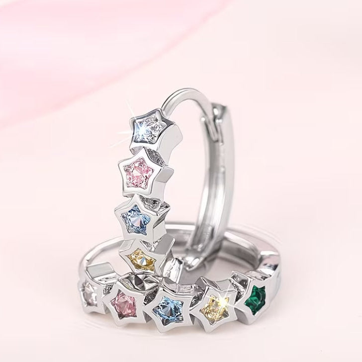 Multicolor Star Hoop Earrings on a light pink background