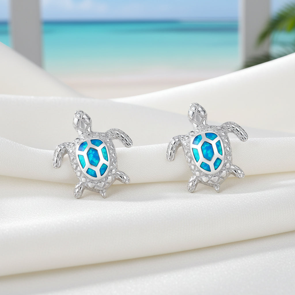 Ocean Blue Sea Turtle Earrings on a light blue background.