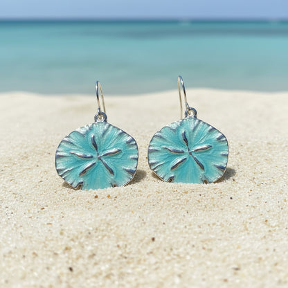 Ocean Mist Sand Dollar Earrings on a beach