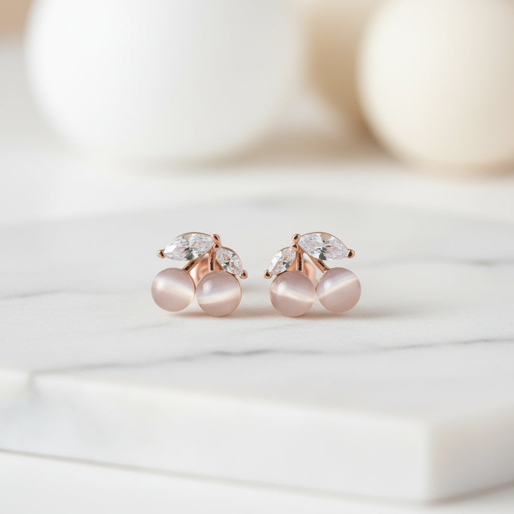 Opalescent Cherry Crystal Earrings on marble