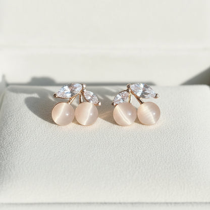 Opalescent Cherry Crystal Earrings on suede
