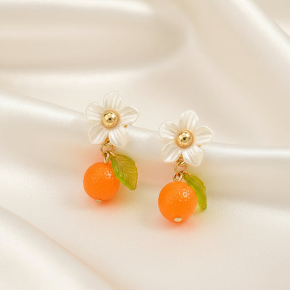 Orange Blossom Dangle Earrings on a light background