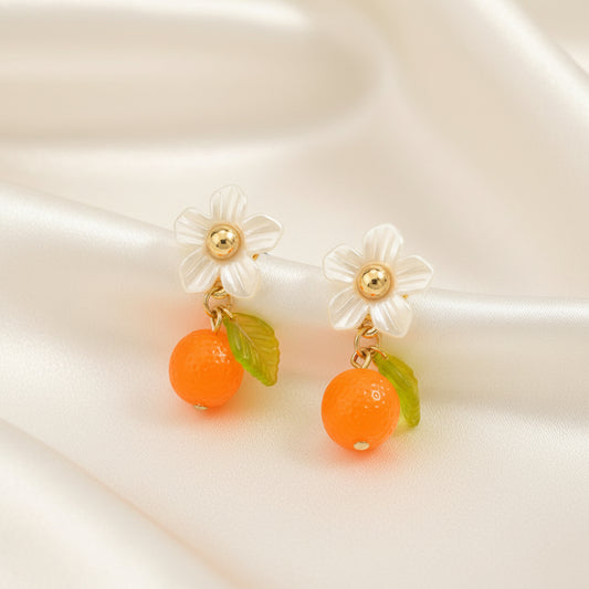 Orange Blossom Dangle Earrings on a light background
