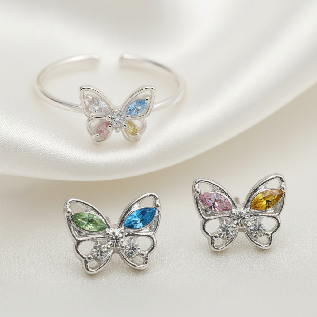 Pastel Butterfly Adjustable Ring & Earrings Bundle with gemstones on a light background