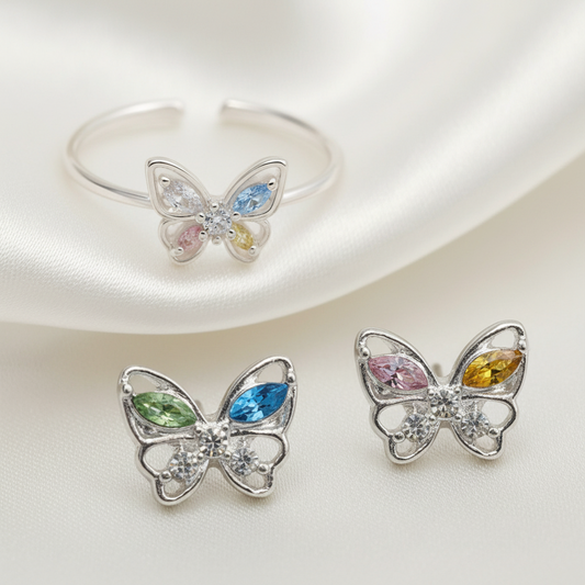 Pastel Butterfly Adjustable Ring & Earrings Bundle with gemstones on a light background