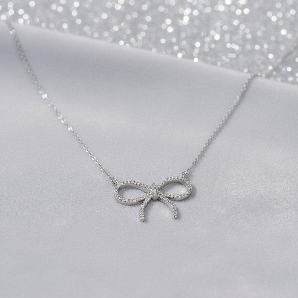 Pavé Bow Necklace on dove grey velvet