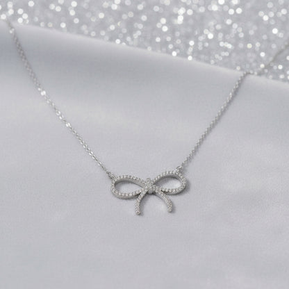Pavé Bow Necklace on dove grey velvet