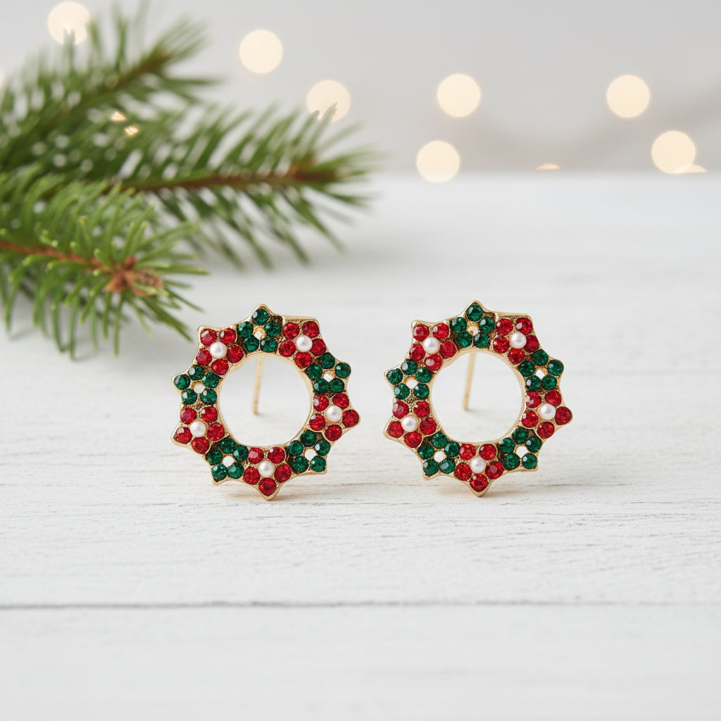 Pavé Christmas Wreath Earrings with a blurred festive background.