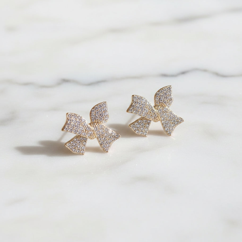 Pavé Crystal Bow Earrings on marble