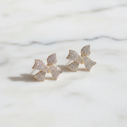 Pavé Crystal Bow Earrings on marble