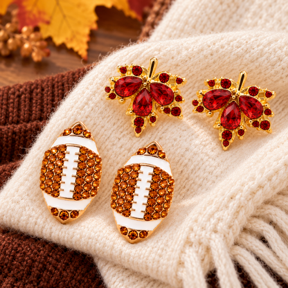 Pavé Football & Maple Leaf Earring Bundle on cream and brown knits