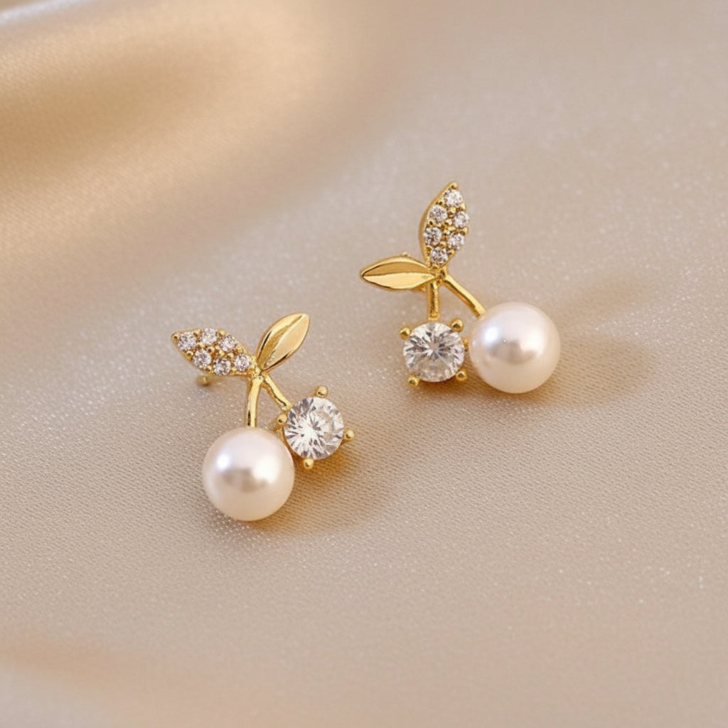 Pearl Cherry Earrings on a beige background