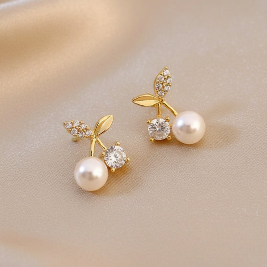 Pearl Cherry Earrings on a beige background