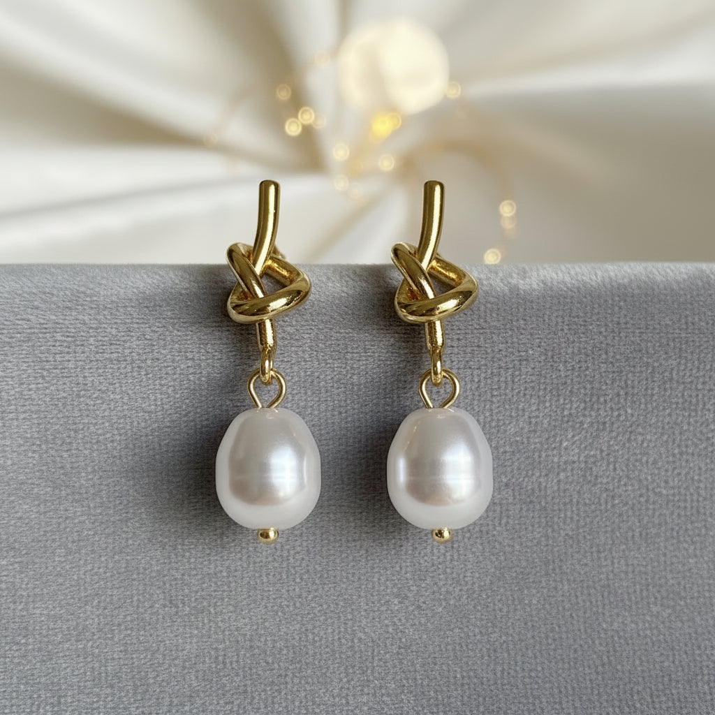 Pearl Knot Drop Earrings on grey velvet