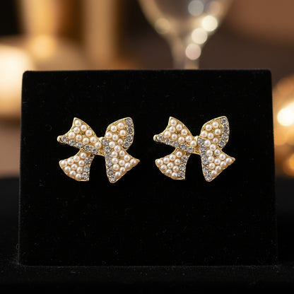 Pearl & Pavé Bow Earrings on black