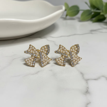 Pearl & Pavé Bow Earrings on marble