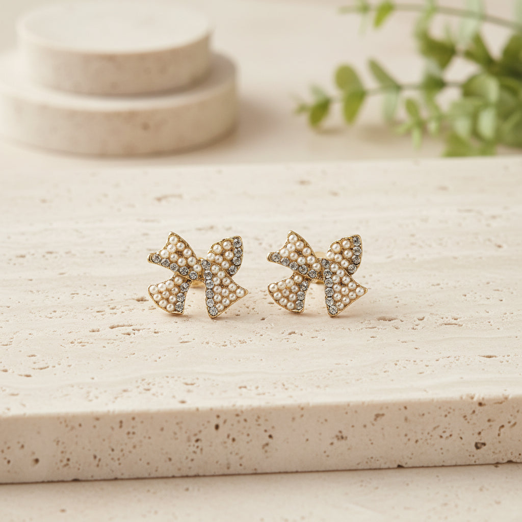Pearl & Pavé Bow Earrings on travertine
