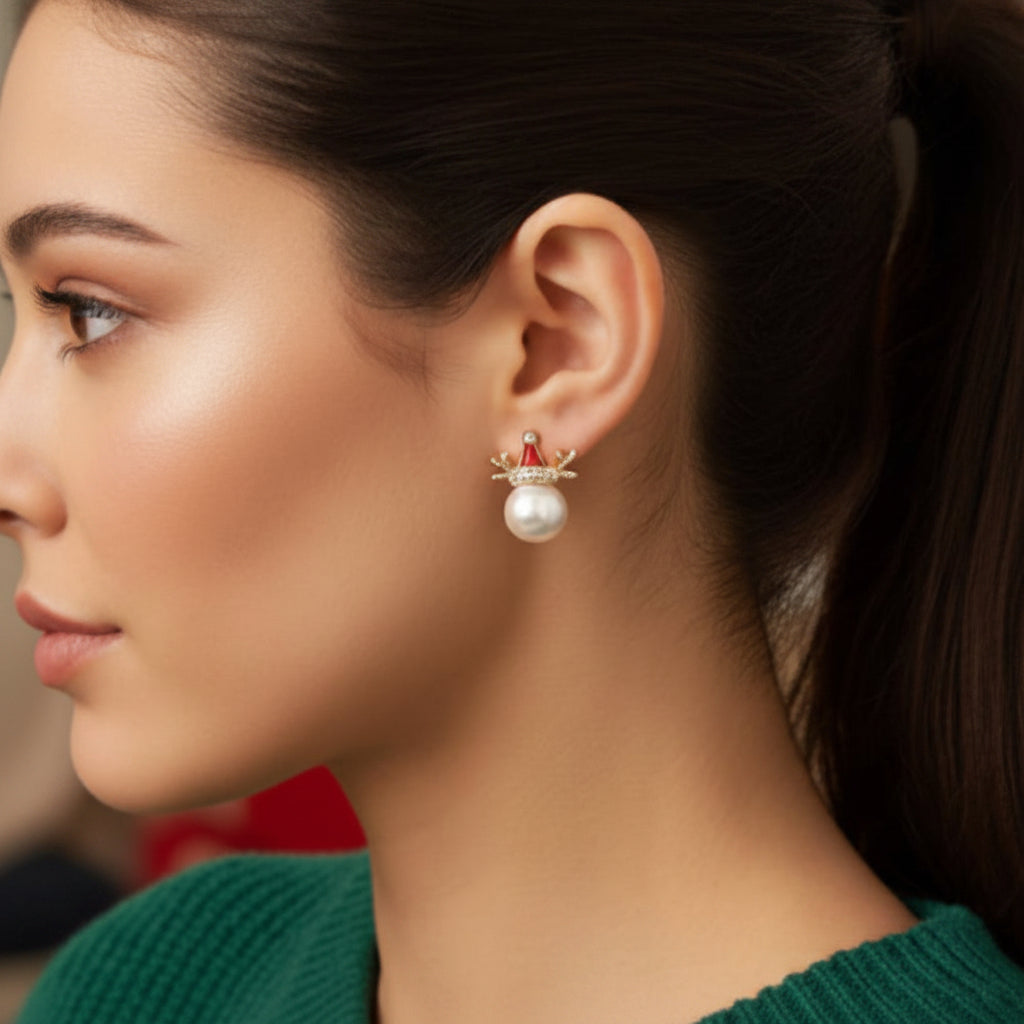 A close-up of a person wearing a Pearl Reindeer Holiday Earring