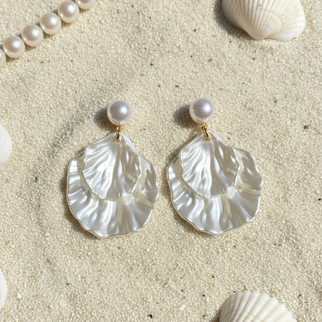 Pearl Shell Earrings on a beach