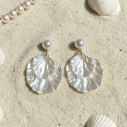 Pearl Shell Earrings on a beach