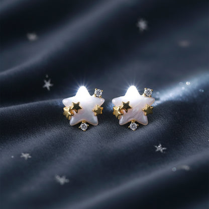 Pearlescent Star & Crystal Earrings on a charcoal background