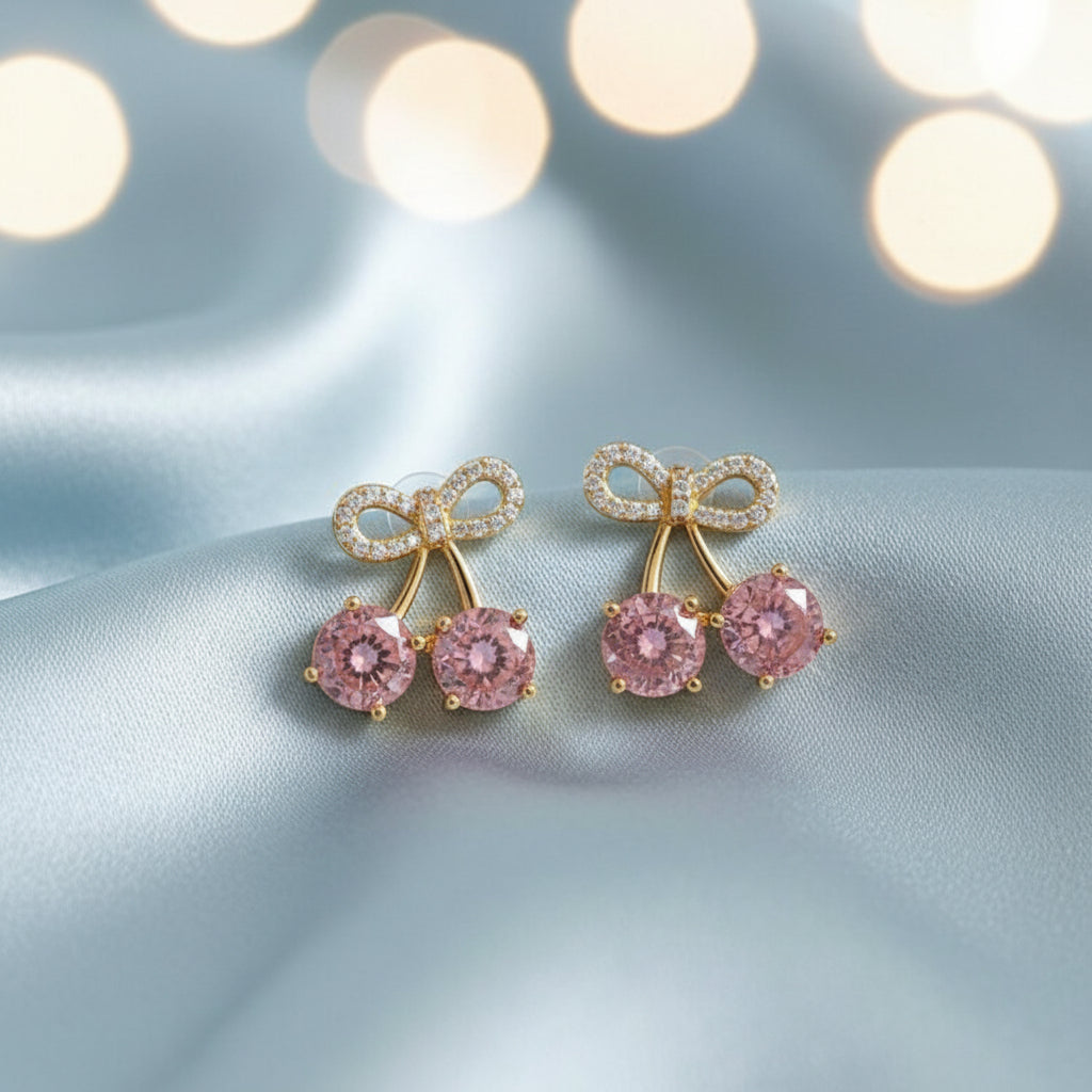Pink Cherry Pavé Bow Earrings on light blue