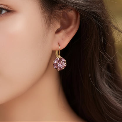Close-up of a woman wearing Pink Crystal Bouquet Earrings