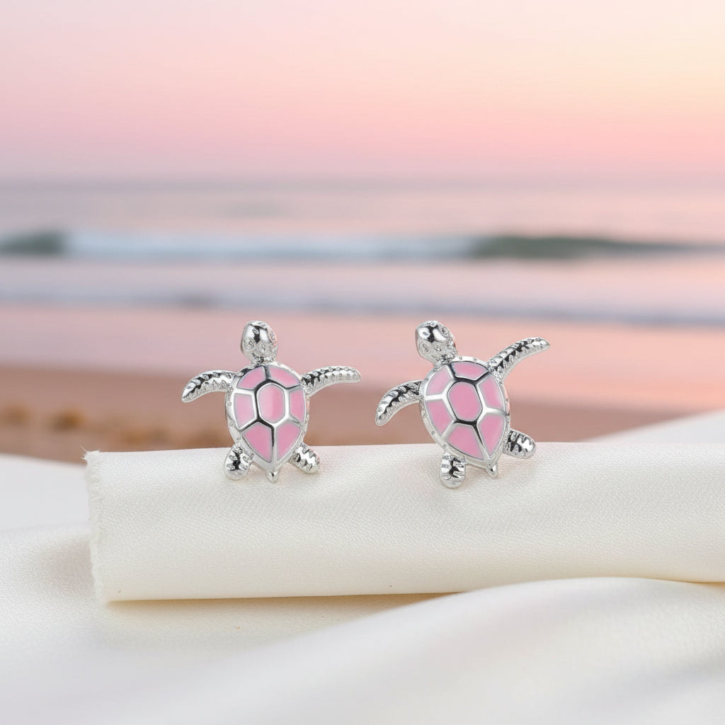 Pink Sea Turtle Earrings on pink beach