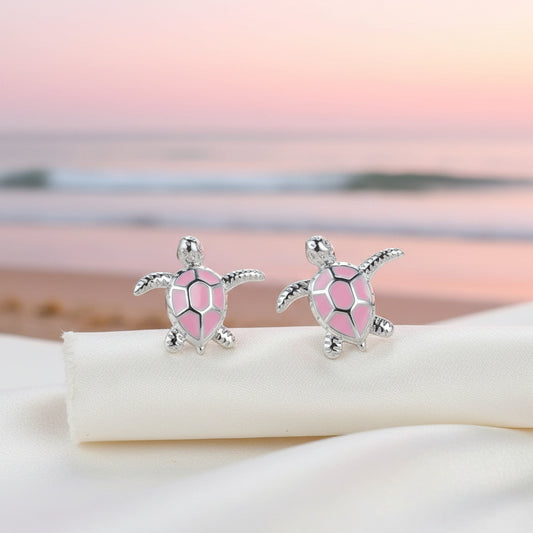 Pink Sea Turtle Earrings on pink beach