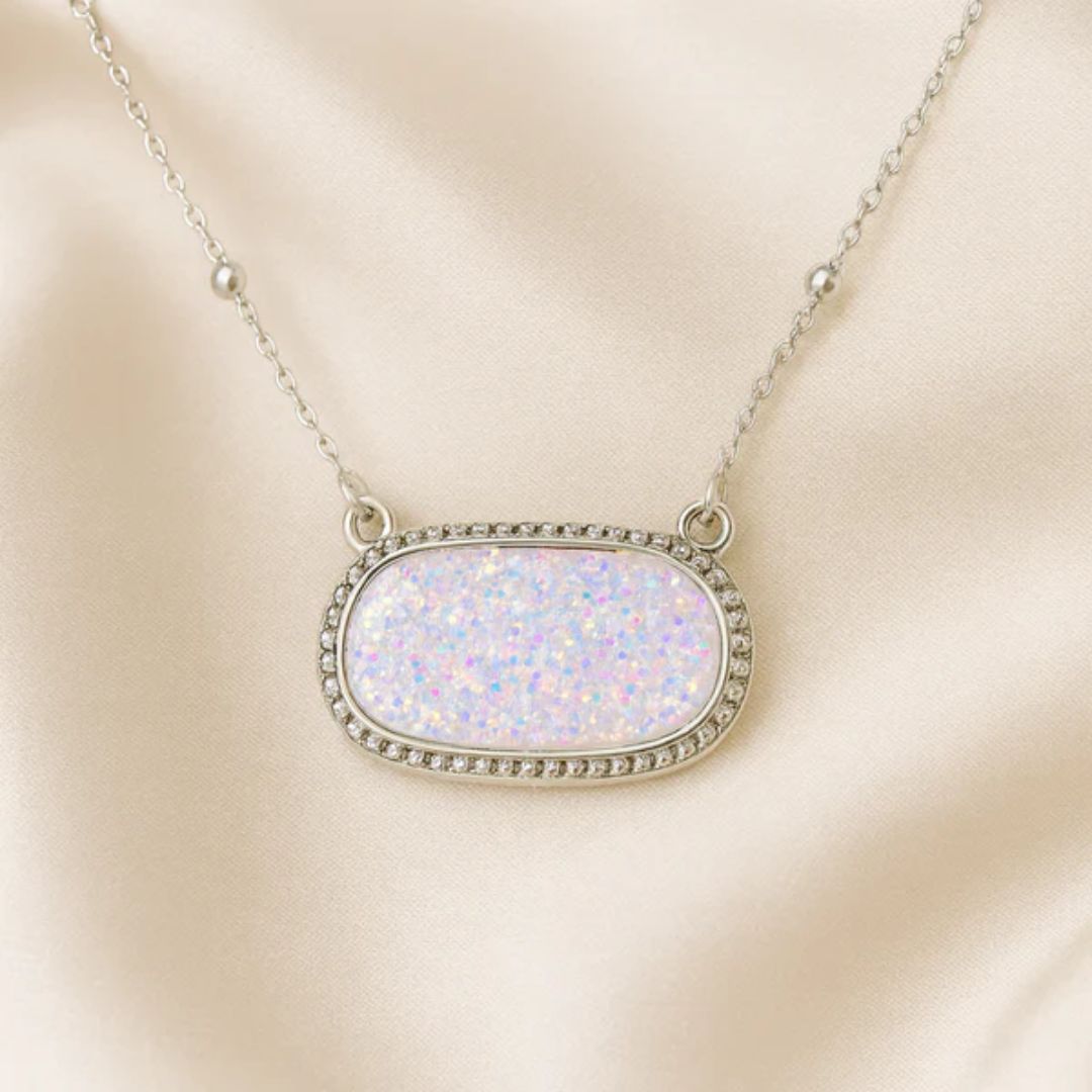 White Opal Druzy Glow Pendant Silver Necklace on a beige background