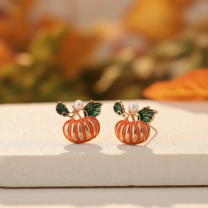 Pumpkin Pearl Earrings on white stone