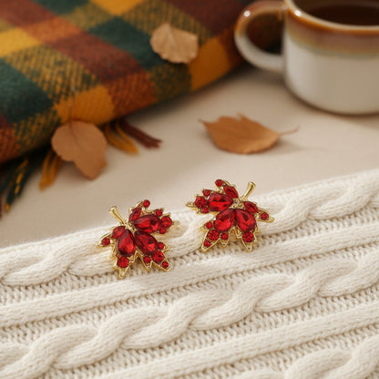 Red Crystal Maple Leaf Earrings on sweater