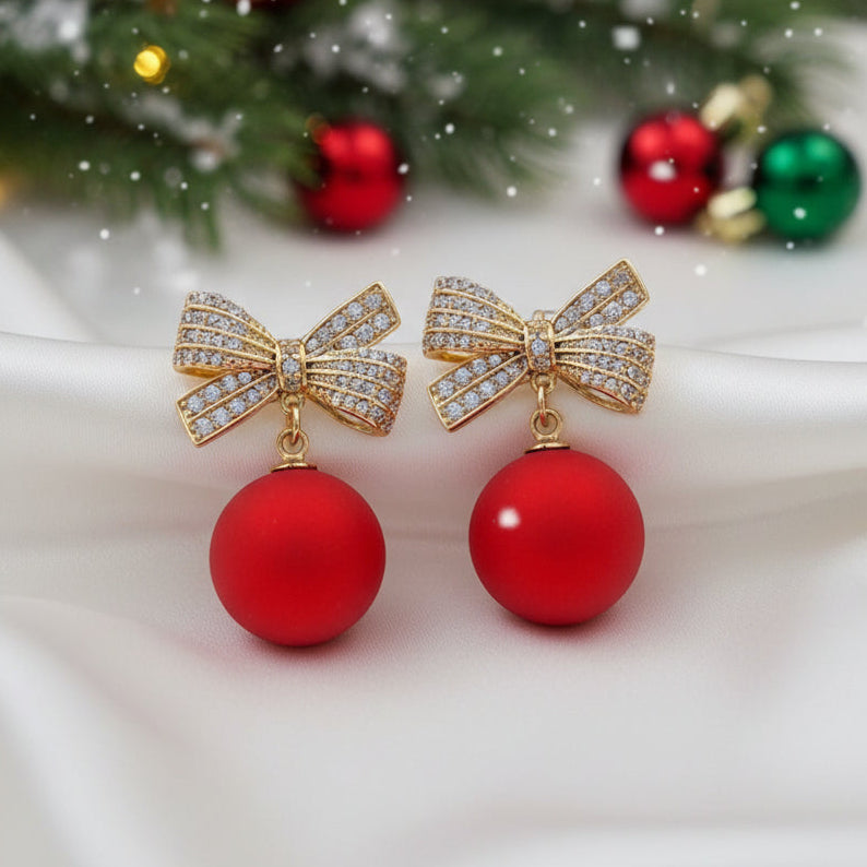 Red Ornament Pavé Bow Earrings on holiday background